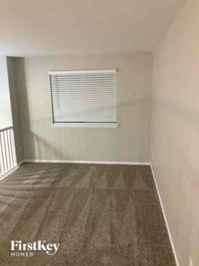 Fountain house for rent - A room with a FirstKey Homes logo on the carpet.