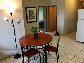 Waterloo apartment for rent - a dining room with a table and chairs and a refrigerator