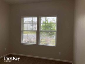 Lowell house for rent - a view of two windows in a room