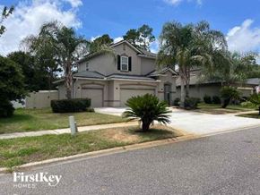 Jacksonville house for rent - a house with a palm tree in front of it