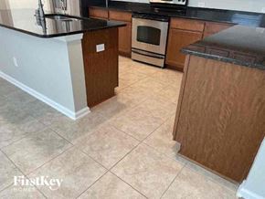 Jacksonville house for rent - a kitchen with a stove and a counter top