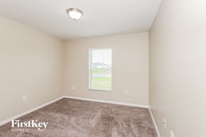 Lehigh Acres house for rent - a spacious room with carpet and a window