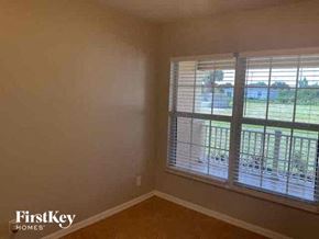 Cape Coral house for rent - an empty room with a large window in it