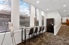 Bellevue apartment for rent - a conference room with a table and chairs and a large window