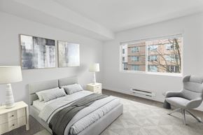 Bellevue apartment for rent - a bedroom with a bed and two windows