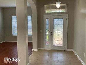 Fleming Island house for rent - an empty living room with a glass door