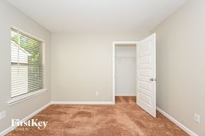 Mcdonough house for rent - a bedroom with a closet and a window and a door