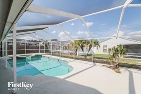 Riverview house for rent - A swimming pool under a white canopy.