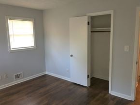 Atlanta house for rent - an empty room with a closet and a window