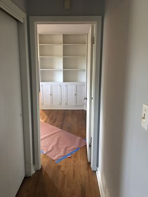 Atlanta house for rent - a room with a closet with shelves and a pink rug