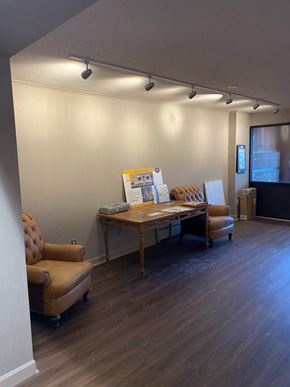 Watertown apartment for rent - a conference room with a table and chairs and a projector