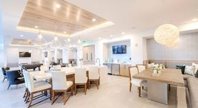 Tampa apartment for rent - A modern dining room with a large table and chairs.