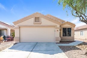 Surprise house for rent - A house with a garage and a driveway.