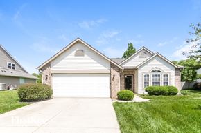 Indianapolis house for rent - A two-story house with a garage and a driveway.