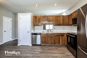 Indianapolis house for rent - A kitchen with wooden cabinets and stainless steel appliances.