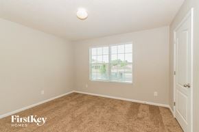 Jacksonville house for rent - a spacious bedroom with carpet and a window