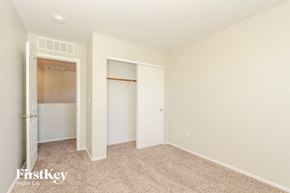 Tucson house for rent - a bedroom with a closet and a door to a closet