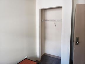 Waterloo apartment for rent - a small closet in a room with a door to a shower