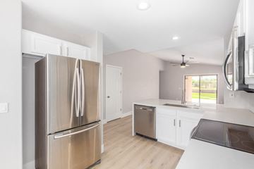 Avondale house for rent - A modern kitchen with a stainless steel refrigerator and a dishwasher.