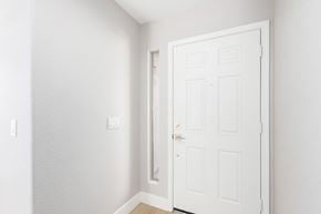 Avondale house for rent - A white door is open in a white room.