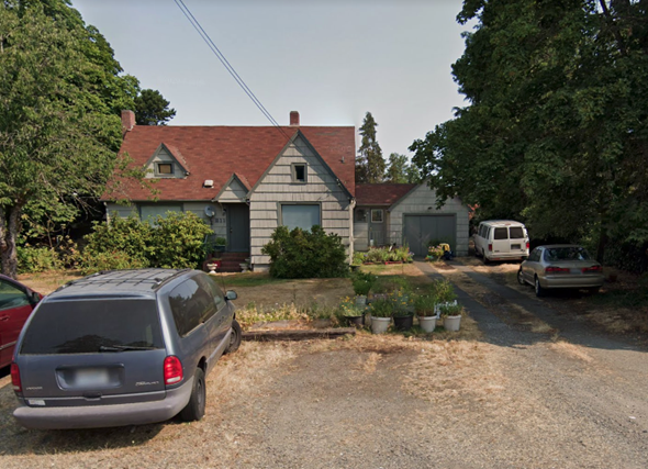Tacoma house for rent - a house with cars parked in front of it