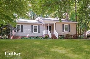 Gastonia house for rent - a small house with a lawn and trees