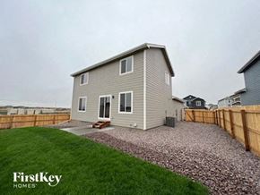 Colorado Springs house for rent - a small house with a yard and a fence