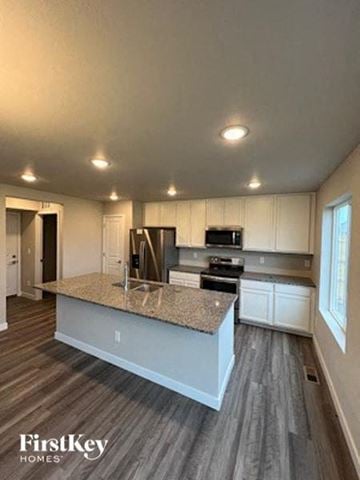 Colorado Springs house for rent - a kitchen with a marble counter top