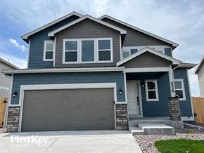 Colorado Springs house for rent - a blue house with a garage door