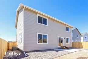 Colorado Springs house for rent - the exterior of a new home with a wooden fence