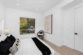 Los Angeles apartment for rent - a white bedroom with a bed and a window