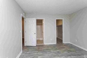 Columbia apartment for rent - an empty living room with a white door and a closet