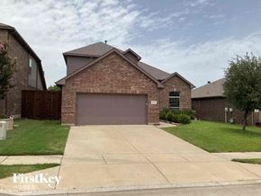 Fort Worth house for rent - a house with a driveway and a garage door