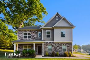 Covington house for rent - a renovated house with a large tree in front of it