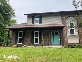 Fairfield house for rent - a brick house with a blue door on a lawn