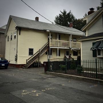 Westfield apartment for rent - A two-story house with a car parked in front.