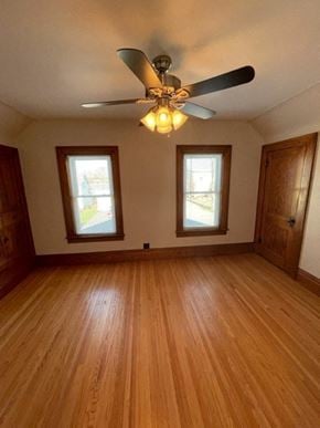 Norwood Young America house for rent - a living room with a ceiling fan and wood floors