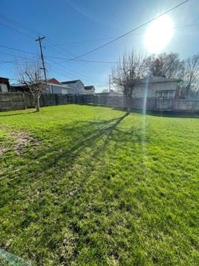 Norwood Young America house for rent - a grassy yard with a sunburst in the sky