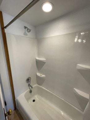 Norwood Young America house for rent - a white bathroom with a tub and a sink