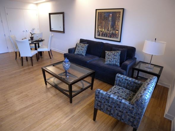 Los Angeles apartment for rent - a living room with a couch and chairs and a table
