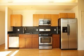 Los Angeles apartment for rent - a kitchen with stainless steel appliances and wooden cabinets