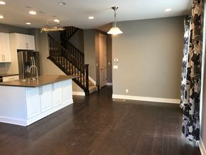 Lakewood house for rent - a view of a kitchen and living room with a staircase