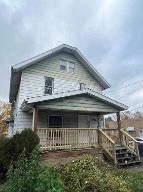 Akron apartment for rent - A house with a porch and a window.