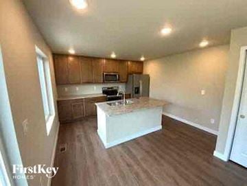 Colorado Springs house for rent - a large kitchen with a white counter top