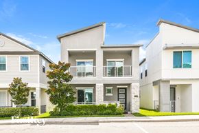 Oakland house for rent - a white house with a sidewalk in front of it