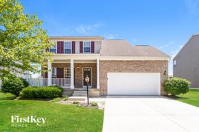 Batavia house for rent - a house with a white garage door in front of it