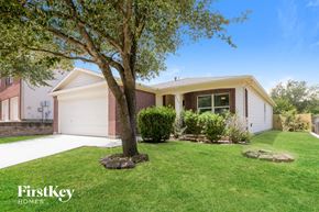 Schertz house for rent - a home with a lawn and a tree in front of it