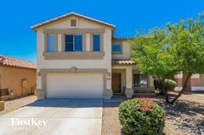 San Tan Valley house for rent - A house with a garage and a driveway in front of it.