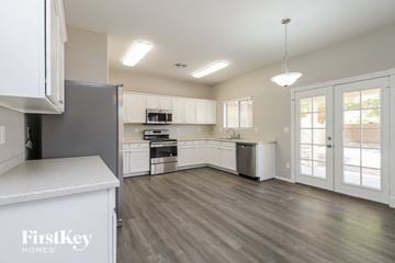 San Tan Valley house for rent - A kitchen with a refrigerator that says FirstKey Homes.