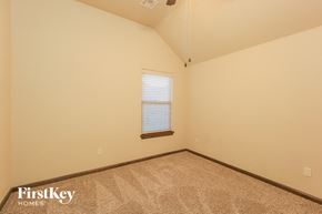 Mustang house for rent - the upstairs bedroom with carpet and a window